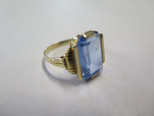 A 14ct gold ring with baguette cut topaz, indistinct hallmarks, overall weight 4.6 grams, size P,