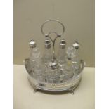 A Regency style silver plated condiments basket with silver top bottles, London 1880, and silver