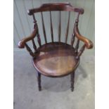 A 19th century penny seat Windsor armchair in good polished condition