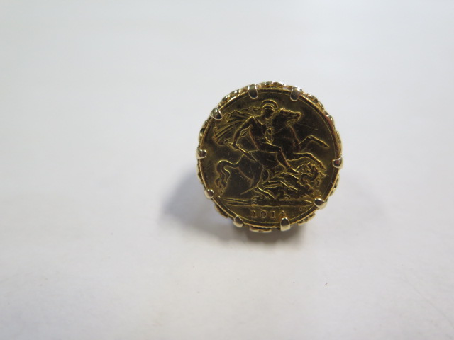 A George V gold half sovereign set in a hallmarked 9ct ring, size J, approx 9.2 grams, generally