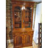 A Victorian mahogany 2-door glazed bookcase over cupboard with a drawer, 202cm tall x 92cm x 49cm,