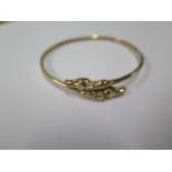A hallmarked 9ct gold horses head bangle, 6.5cm x 6.5cm, approx 9.7 grams, small split and some