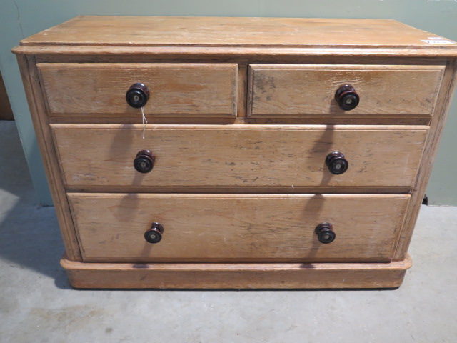 A 19th century pine chest with two short over two long drawers, 108cm wide x 75cm high