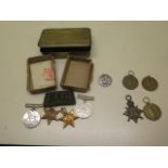 A WWI christmas tin and four WWI medals, silver services rendered badge and four boxed WWII medals