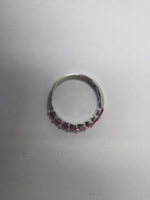 An 18ct white gold diamond and ruby 17 stone diamond ring, marked 750, ring size M, approx 2.8gs, in - Image 3 of 3