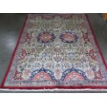 A hand knotted woollen Herisz rug, 2.80m x 1.80m, in good condition