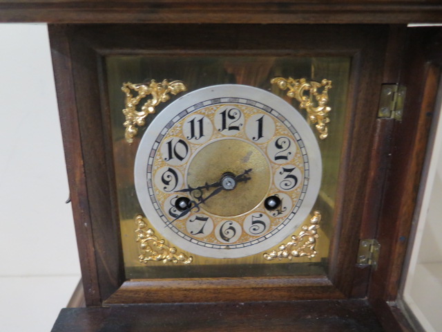 A Junghams walnut mantle clock striking on a single coil gong, 45cm tall, in running order and