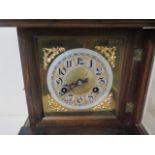 A Junghams walnut mantle clock striking on a single coil gong, 45cm tall, in running order and