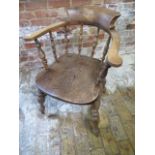 A Victorian ash and elm smokers bow armchair, 85cm tall x 65cm wide, in sturdy condition