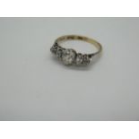 A good 9ct gold and platinum five stone diamond ring with a central pear shaped diamond measuring