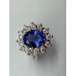 An impressive platinum sapphire and diamond ring, the central natural untreated 4.71ct blue sapphire