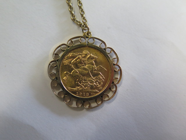 A George V gold full sovereign dated 1918 in a 9ct hallmarked pendant mount on a 9ct hallmarked - Image 2 of 3