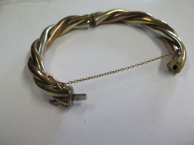 A 9ct tricolour gold hinged hollow bangle, 8cm x 6.8cm external, approx 36 grams, clasp working - Image 3 of 4