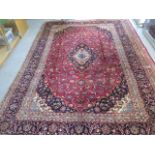 A hand knotted woollen kashan rug. 3.60 x 2.42m