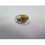 A pretty hallmarked 18ct yellow gold diamond and ruby ring, size O, approx 2.6 grams, central
