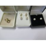 A pair of pearl 14ct gold drop earrings, 2cm long, a pair of 9ct stud pearl earrings and a gold