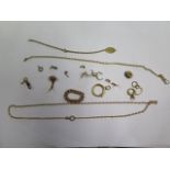 A broken French 18ct gold ring, 3 broken charms, 3 clasps, a chain ring, all test to approx 18ct,