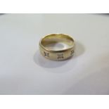A yellow gold three stone diamond band ring, size Q/R, tests to 9ct, approx 7.2 grams, in good