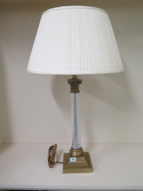 A brass table lamp with a twisted glass stem with shade, 74cm tall