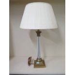 A brass table lamp with a twisted glass stem with shade, 74cm tall