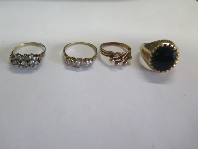 Four 9ct yellow gold rings, total weight approx 15.4 grams, one ring cut while others intact,