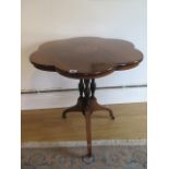 An Edwardian fine rosewood tripod table with inlaid shaped top on three turned and reeded column and