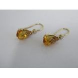 A 18ct yellow gold citrine and diamond drop earrings, marked 750, and hallmarked, 15mm in length,