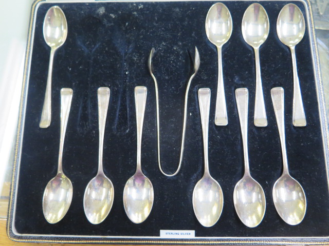 A part silver teaspoon set with nips, 10 spoons instead of 12, total silver weight approx 4.8 troy