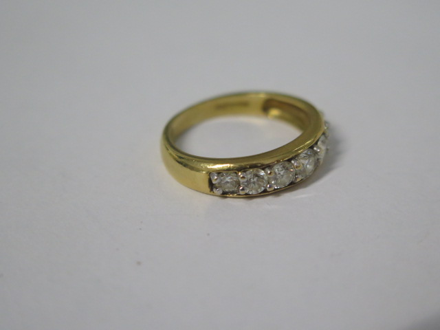 An 18ct hallmarked yellow gold seven stone diamond ring, total ct 1.00, ring size N, approx 4.4 - Image 2 of 4