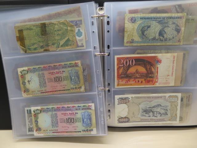 A collection of World bank notes, approx 100, in a black ring binder