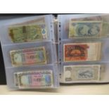 A collection of World bank notes, approx 100, in a black ring binder