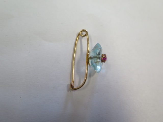 A French 18ct gold brooch with a Ruby set into a light blue hexagonal cut stone, possibly an - Image 3 of 4