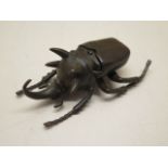 A bronze stag beetle, 9cm long, in good condition