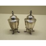 A pair of silver peppers, 8cm tall, 2.65 troy oz, both generally good with some rubbing
