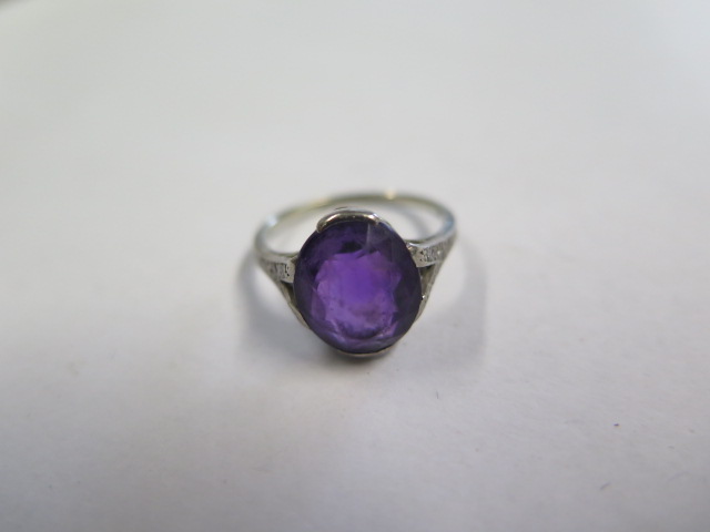 A platinum amethyst ring, amethyst approx 11.5mm x 10mm x 6mm, set with small diamonds to the - Image 2 of 3