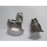 A 925 filled silver owl pin cushion, 4cm tall, and a hallmarked silver rocking horse pin cushion,