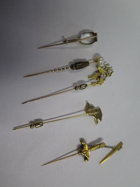 A collection of six tie pins including a sword, one pin marked 18ct, total weight with base metal - Image 4 of 4