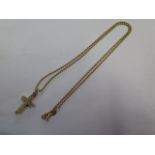A 9ct yellow gold hallmarked crucifix, 2cm tall, approx 2.6 grams, on a hallmarked 18ct chain 45cm
