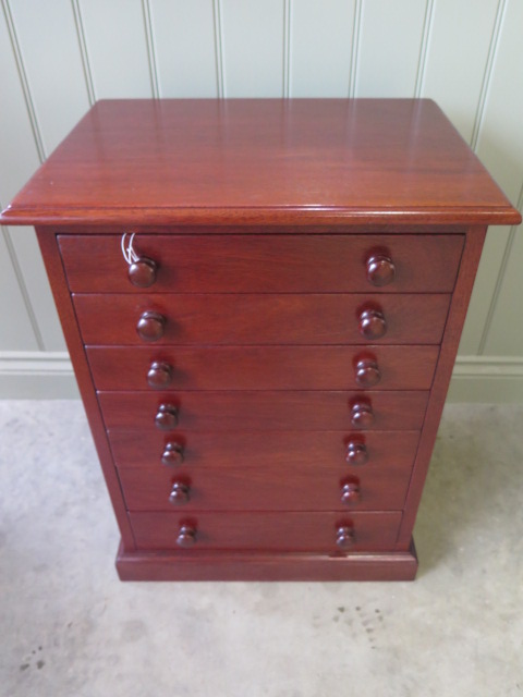 A 20th century mahogany seven drawer collectors chest, 65cm tall x 49cm x 36cm, in good polished