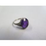 A platinum amethyst ring, amethyst approx 11.5mm x 10mm x 6mm, set with small diamonds to the