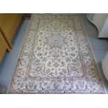 A hand knotted woollen fine Kashan rug, 2.4m x 1.55m, in good condition