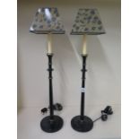 A pair of painted table lamps with shades, 74cm tall