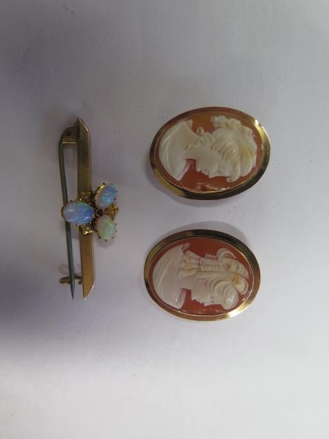 Two 14K gold cameo brooches, 3cm x 2.3cm, approx 6.9 grams, both good condition, and a 9ct opal