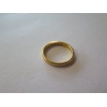 A hallmarked 22ct yellow gold band ring, size L, approx 3.3 grams, generally good with some usage