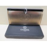 A Chanel gilt leather purse with compartmented interior, boxed, 19cm wide, in good condition but box