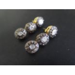A pair of silver gilt three stone rough cut diamond earrings, 3.5cm long, in good condition