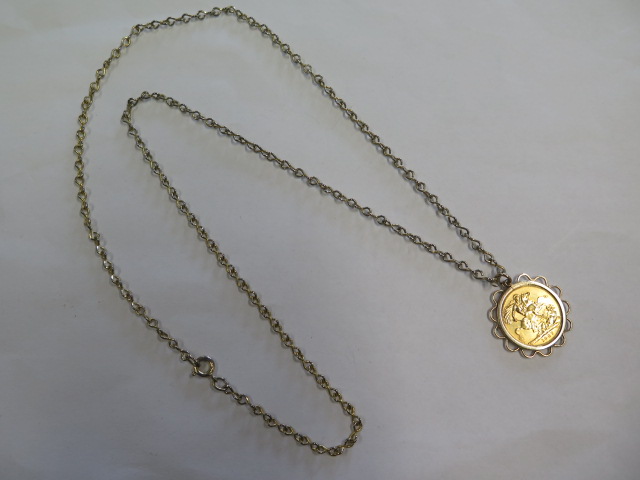 An Elizabeth II gold full sovereign dated 1967 in a hallmarked 9ct pendant mount on a plated 70cm
