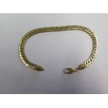 An 18ct yellow gold bracelet, 21cm long, marked 750, approx 8.5 grams with clasp working but hoop