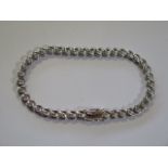 An 18ct white gold diamond bracelet, 18.5cm long, marked 750, set with 39 diamonds each approx 0.03c