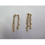 A pair of 18ct yellow gold earrings, marked 750, tassle drop 15cm, total weight approx 7 grams, in